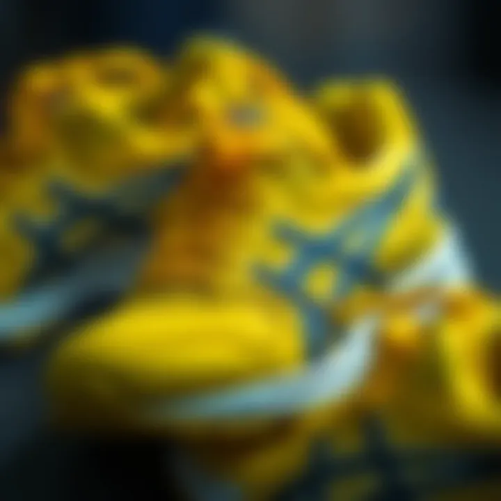 Close-up of the intricate design details of Asics yellow shoes