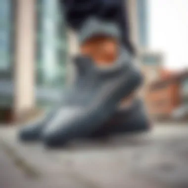 Stylish Grey Vans in Urban Setting Stylish grey Vans shoes on a modern urban background