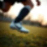 A child demonstrating agility on the field wearing Nike Phantom cleats