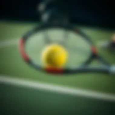 Close-up of a tennis racket hitting the ball during a serve